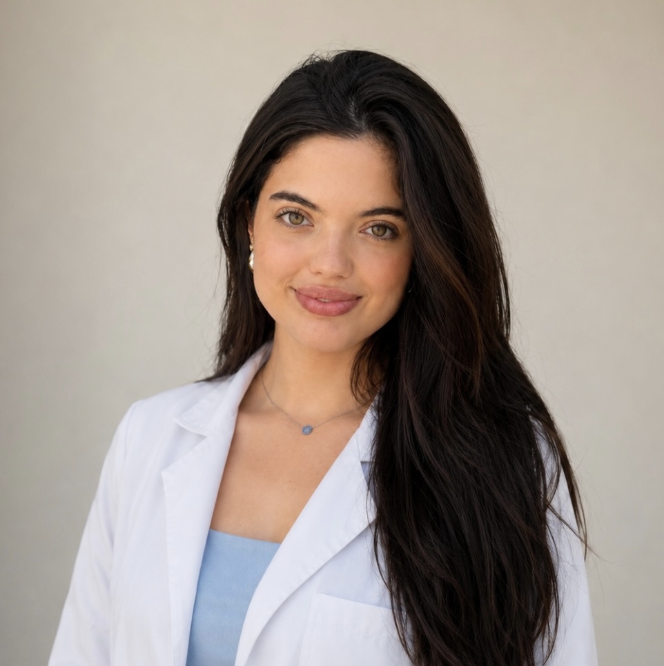 Beatriz Polita wearing a white coat and stethoscope